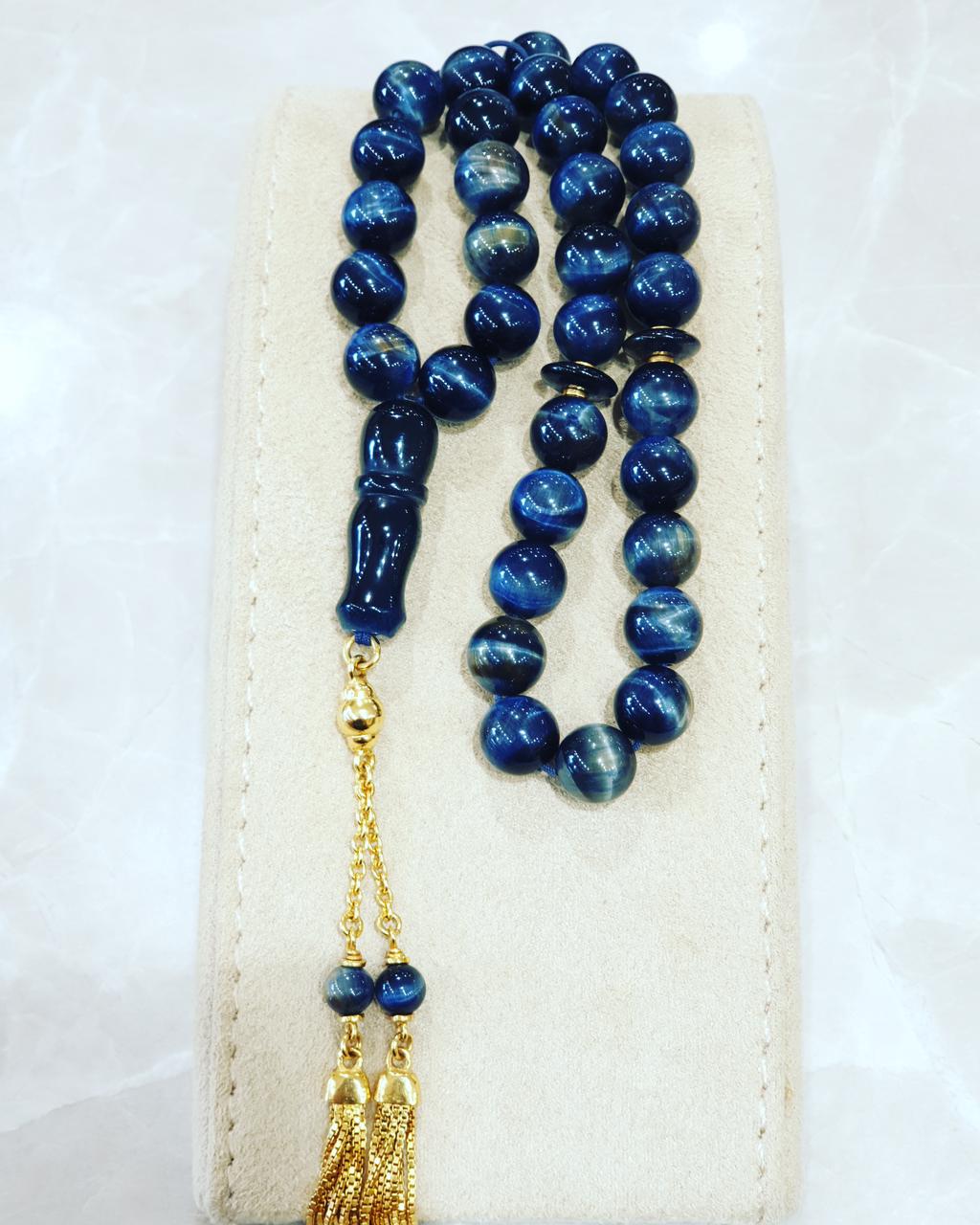 Royal blue worry beads with a gold tassel