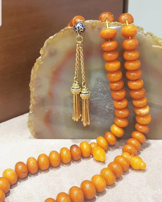 Perles d'inquiétude orange de Princeton avec un pompon d'or